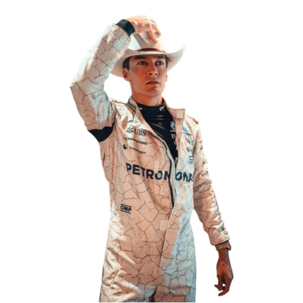 Person wearing a racing suit with 'Petronas' branding on a white background