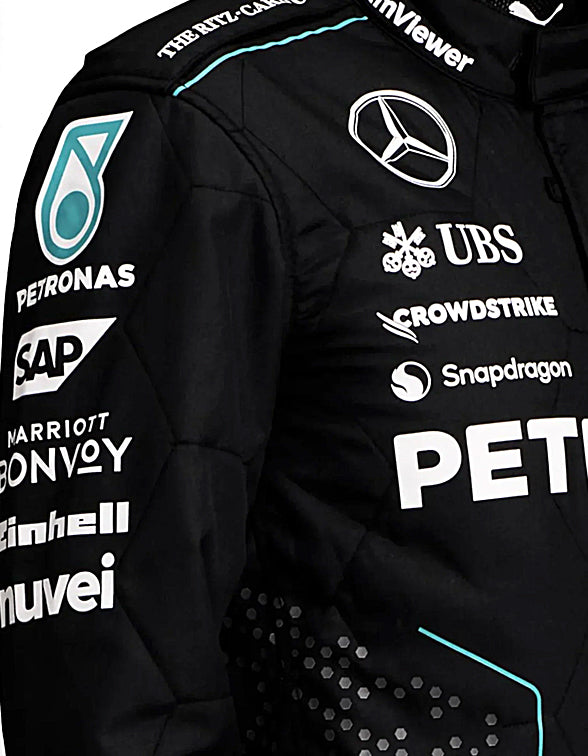 Black jacket with various sponsor logos on a dark background